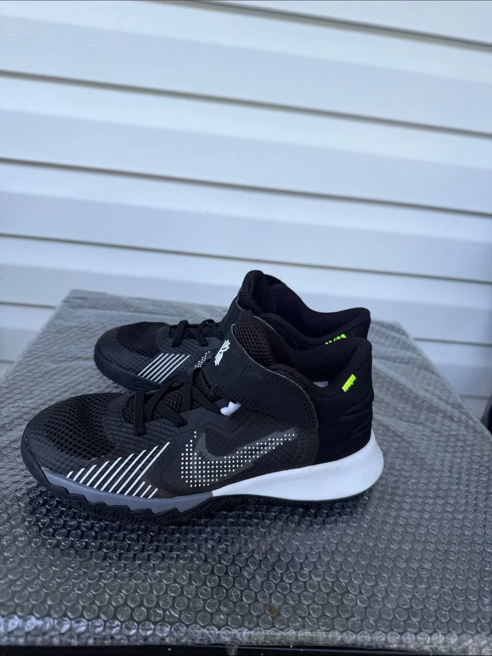 Nike Kids Black and White High-Top Sneakers with Neon Accent